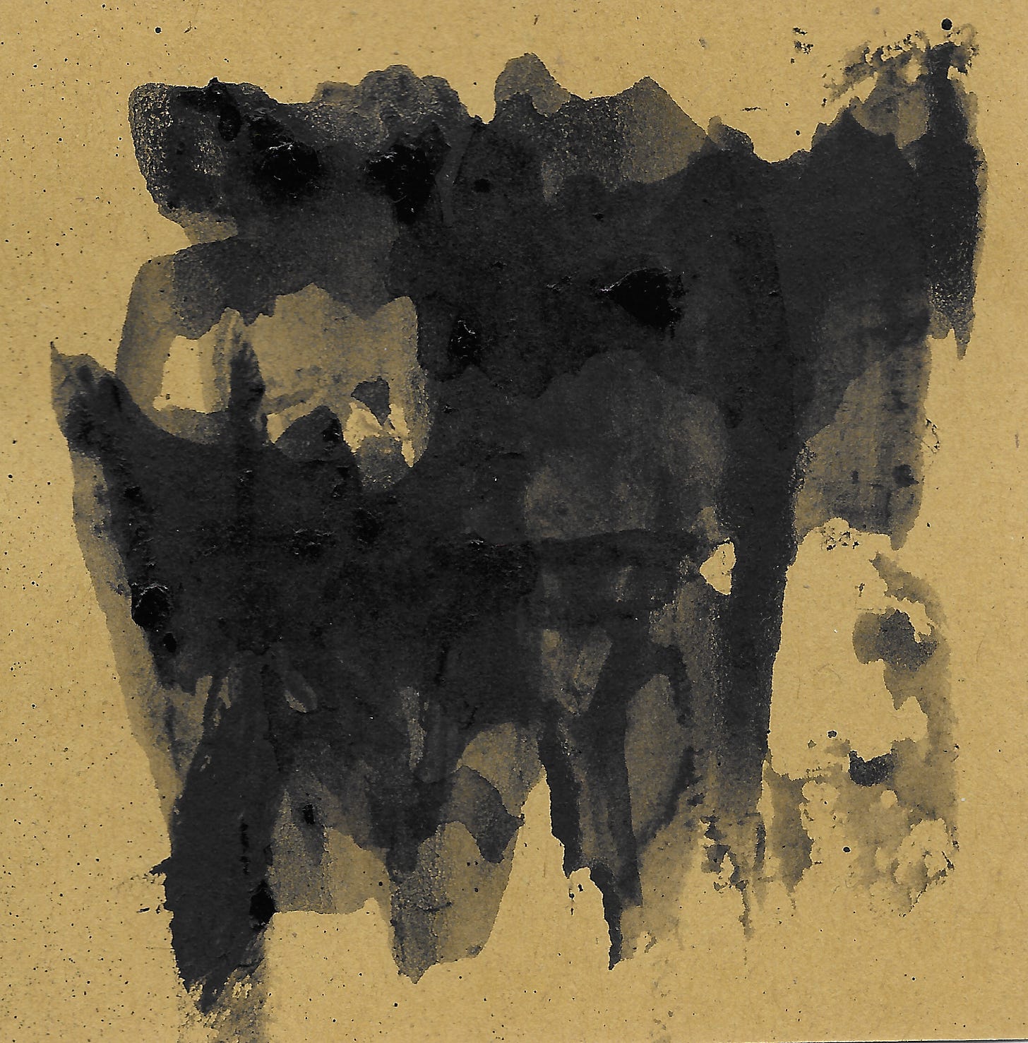 black in smeared in layers on brown paper.