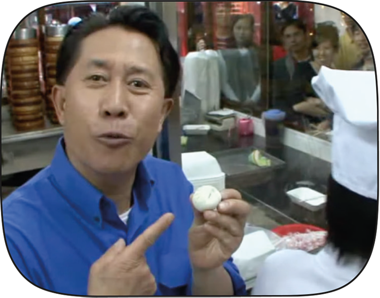 Martin Yan points to a xiaolongbao that he has just pleated himself