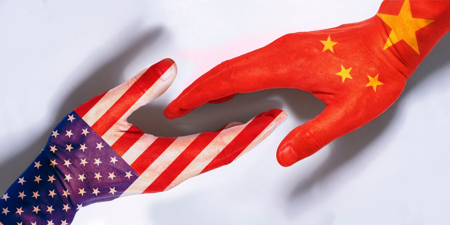 The U.S. and China shake hands.