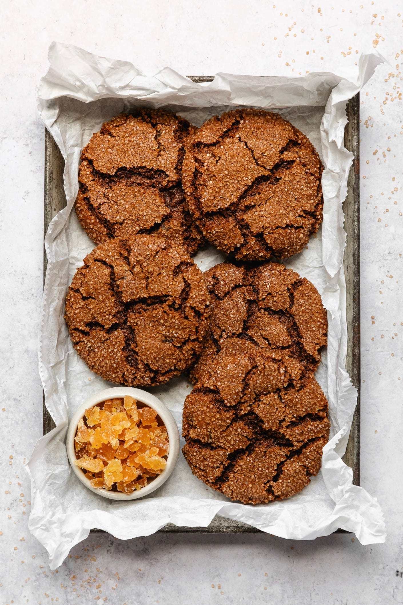 Vegan ginger molasses cookies in tray on white background