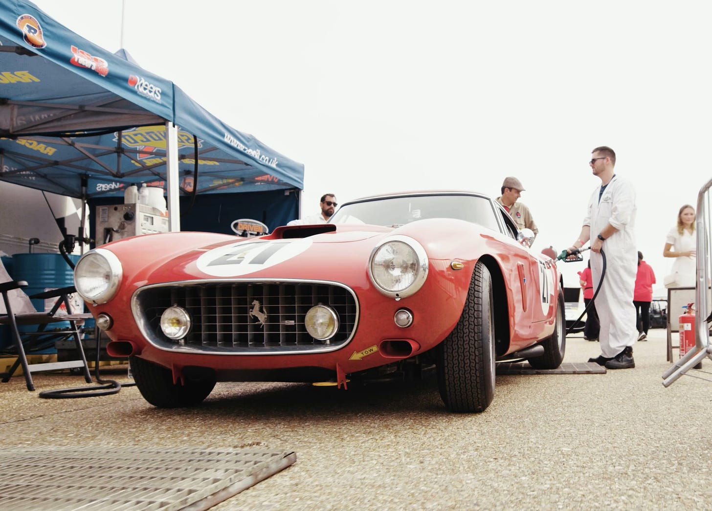 A Ferrari being refueled. 