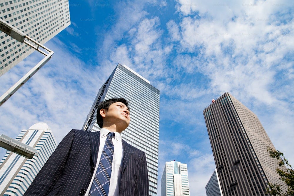 Portrait of Asian (Japanese) businessman on business street in Tokyo, Japan