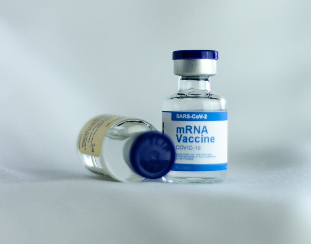 white and blue labeled bottle white and blue labeled bottle