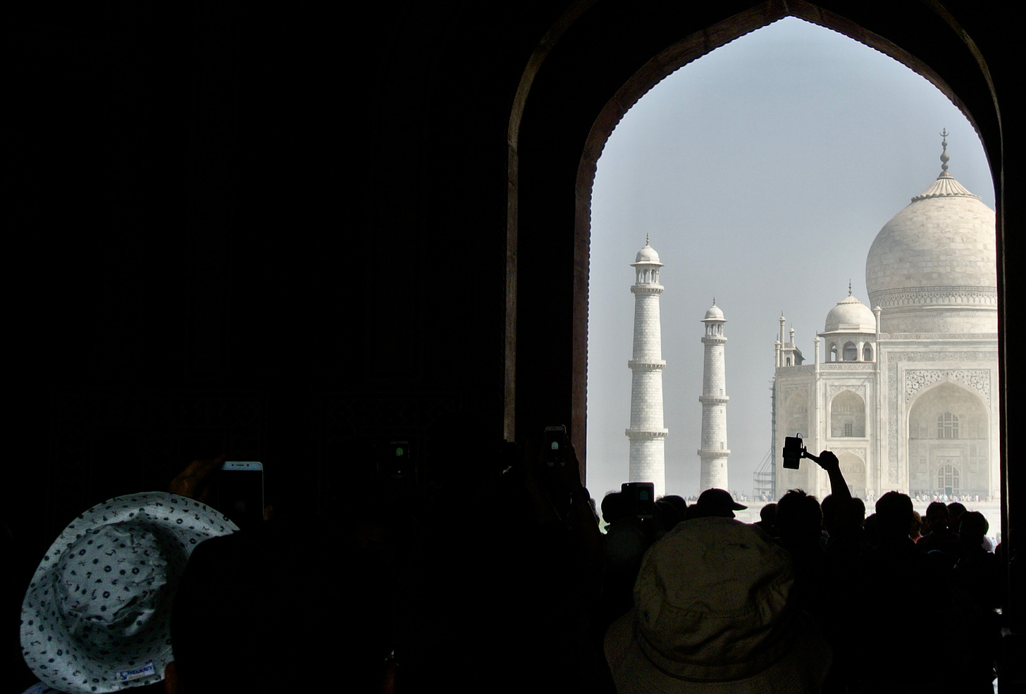 Tourists take photographs at the Taj Mahal 