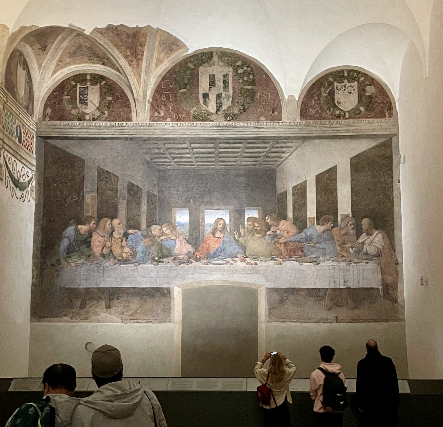 View of Leonardo Da Vinci's "The Last Supper" from mid distance showing the large size of the mural