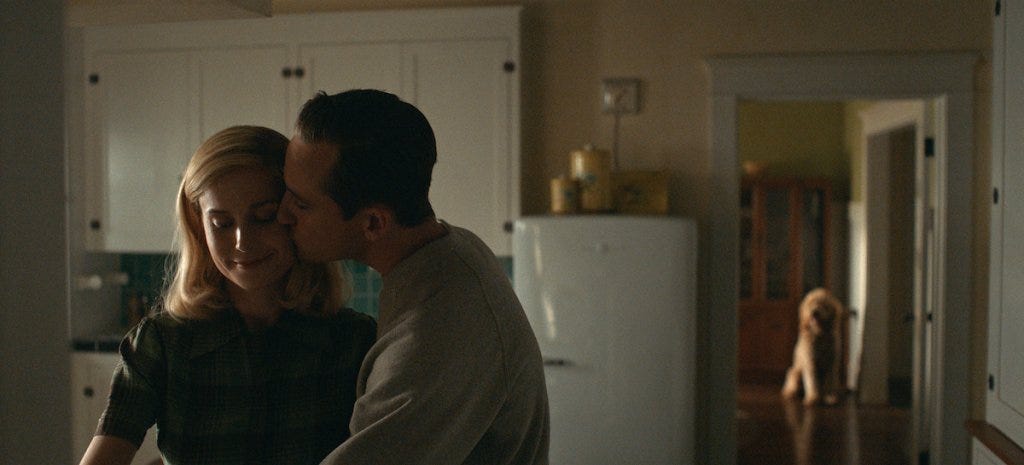 Brie Larson and Lewis Pullman in "Lessons in Chemistry." (Photo courtesy Apple TV+)