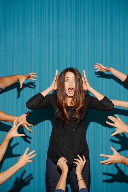 Portrait of stressed woman with shocked facial expression