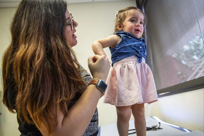 A 15-month-old in Orlando, Florida, is taken to receive her basic immunisation shots