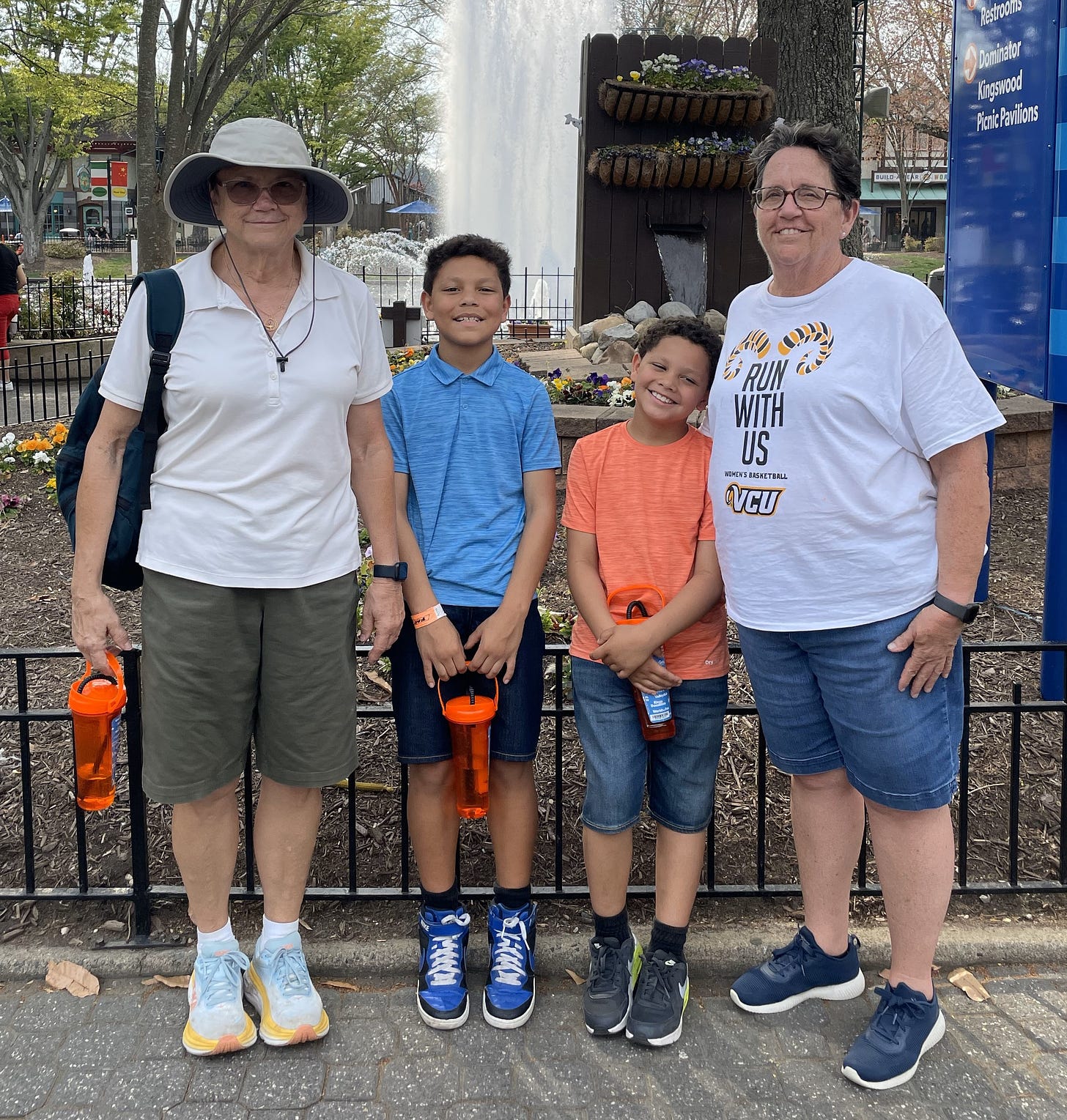 Two older women and two young boys at an amusement park