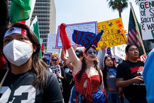 No Kings protesters march.