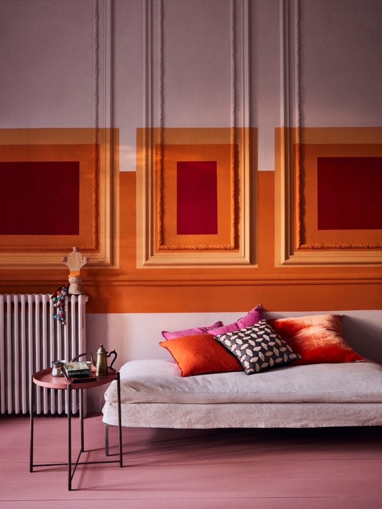 Kate Watson-Smyth continues her colour psychology feature and this time it's orange, an energising and optimistic shade. Orange sits happily with pink and burgundy as you can see in this Annie Sloan painted living room. #anniesloan #orangeinteriors #livingroom #madaboutthehouse 