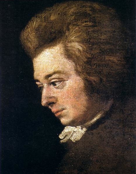 Detail of an oil painting portrait of Mozart, who's seen in profile looking down against a black background