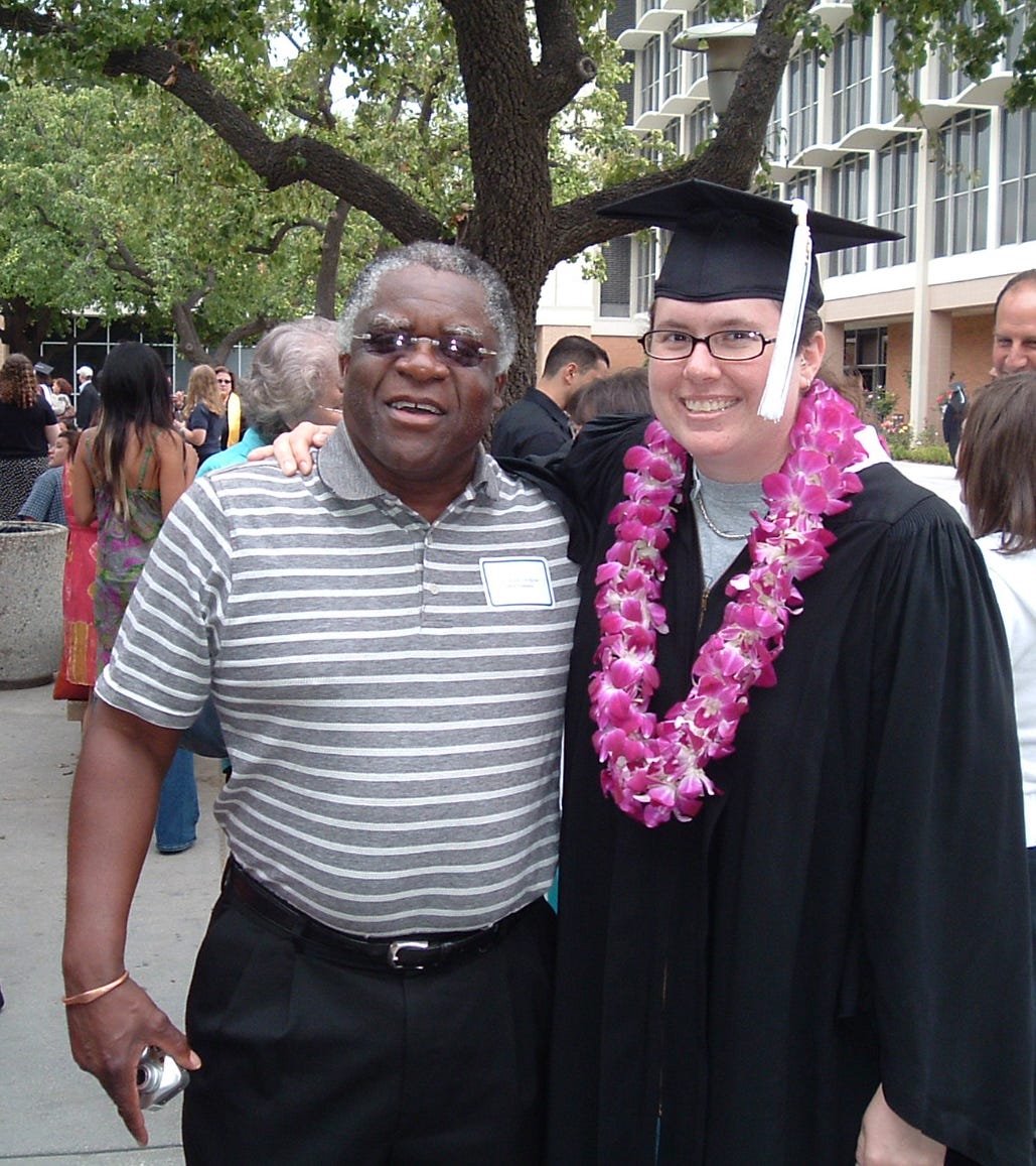 Dr. Herman DeBose on the left with Chris Wells on the right. CSUN Graduation 2005.
