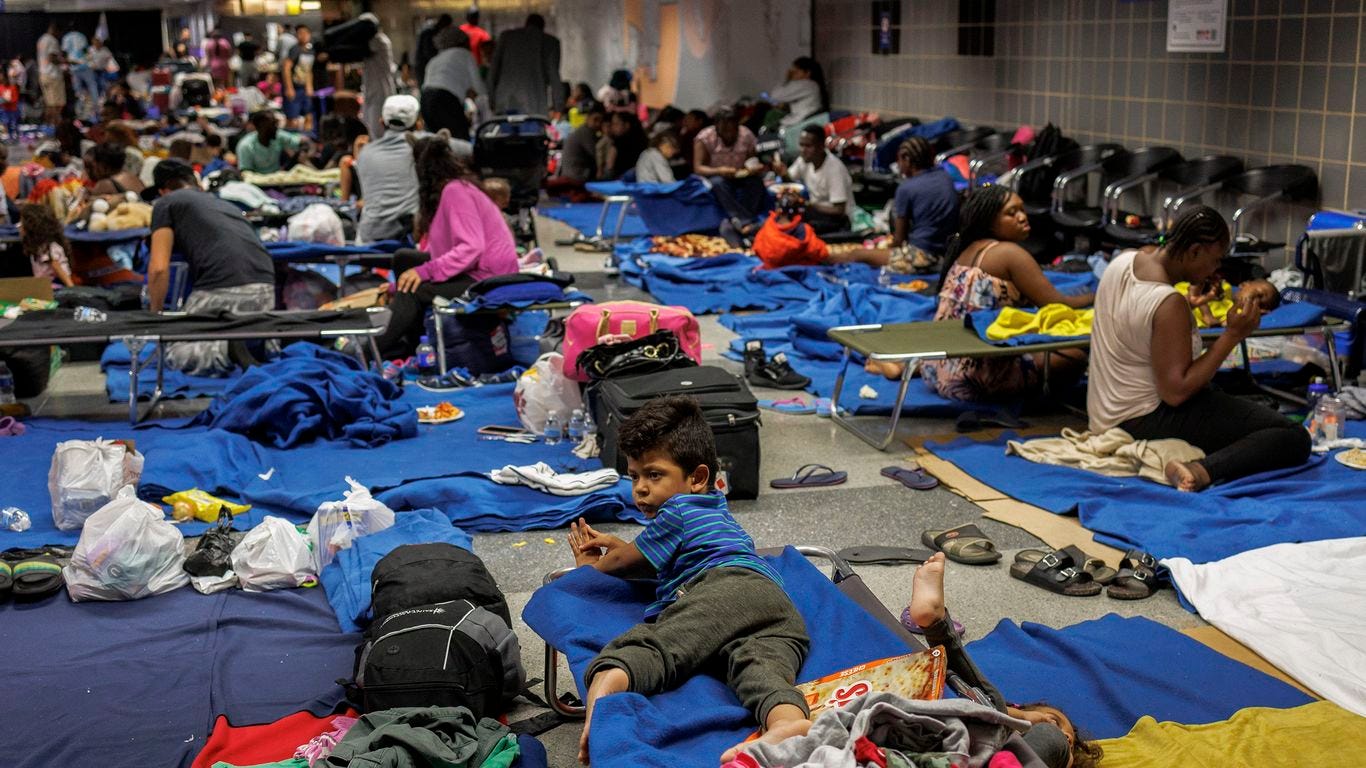 Chicago may move some migrants to tented "base camps," mayor says ...