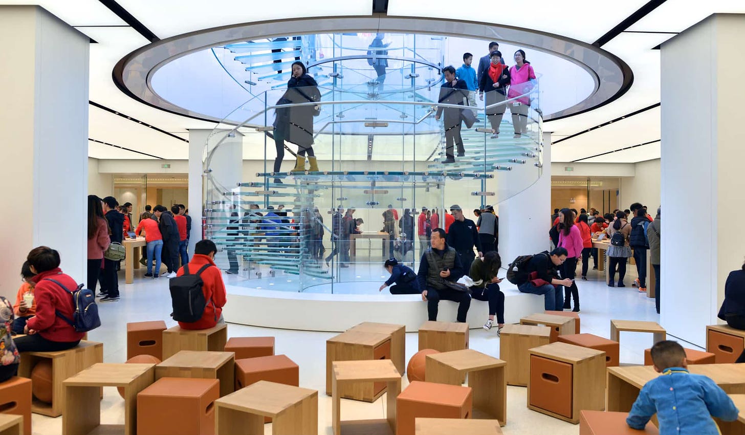 The interior of Apple Kunming, taken from the Forum pointing toward the glass staircase.