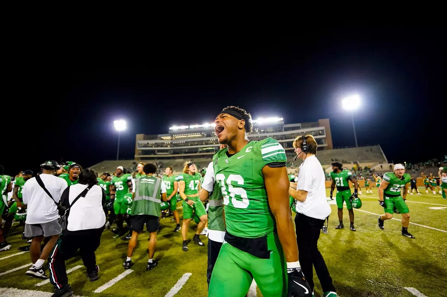 North Texas linebacker Jaylen Smith screams on the sideline during a North Texas Mean Green football game.