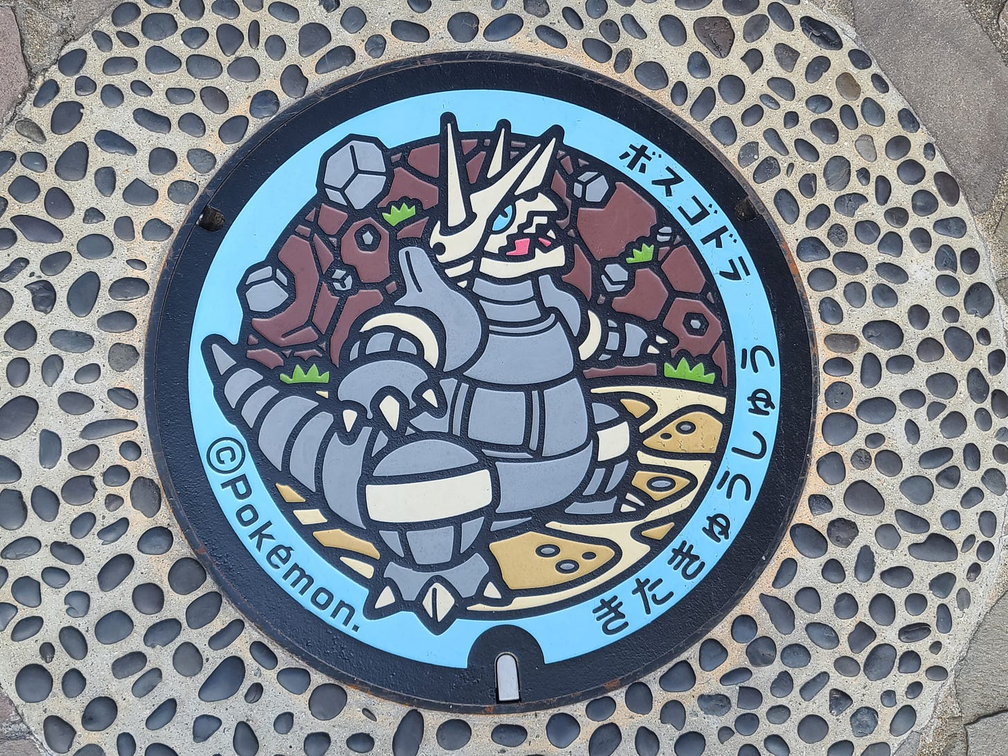 This Pokélid featuring Aggron is one many utility hole covers found around Japan
