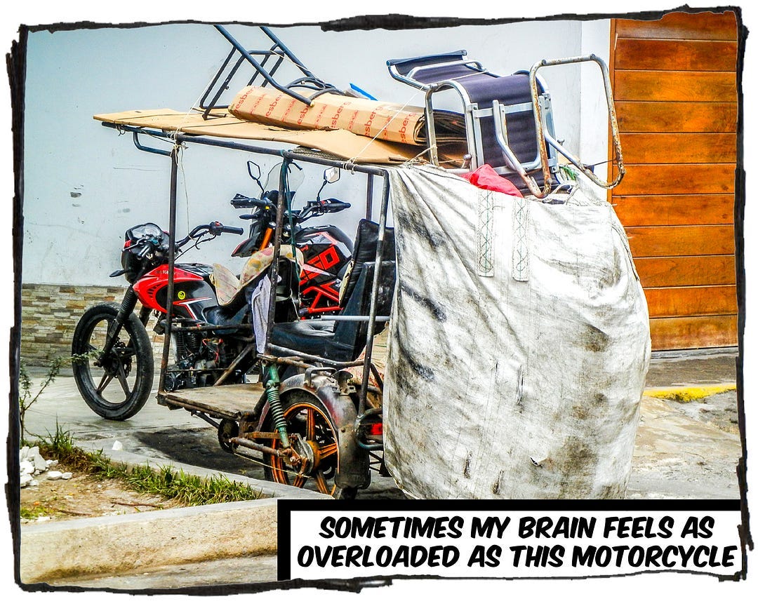 An image of a motorcycle bearing a huge bag hanging off the back. The caption reads, “Sometimes my brain feels as overloaded as this motorcycle.”