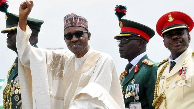 Nigerian President Muhammadu Buhari (2-L) waves to supporters during his inauguration in Abuja, Nigeria 29 May 2015