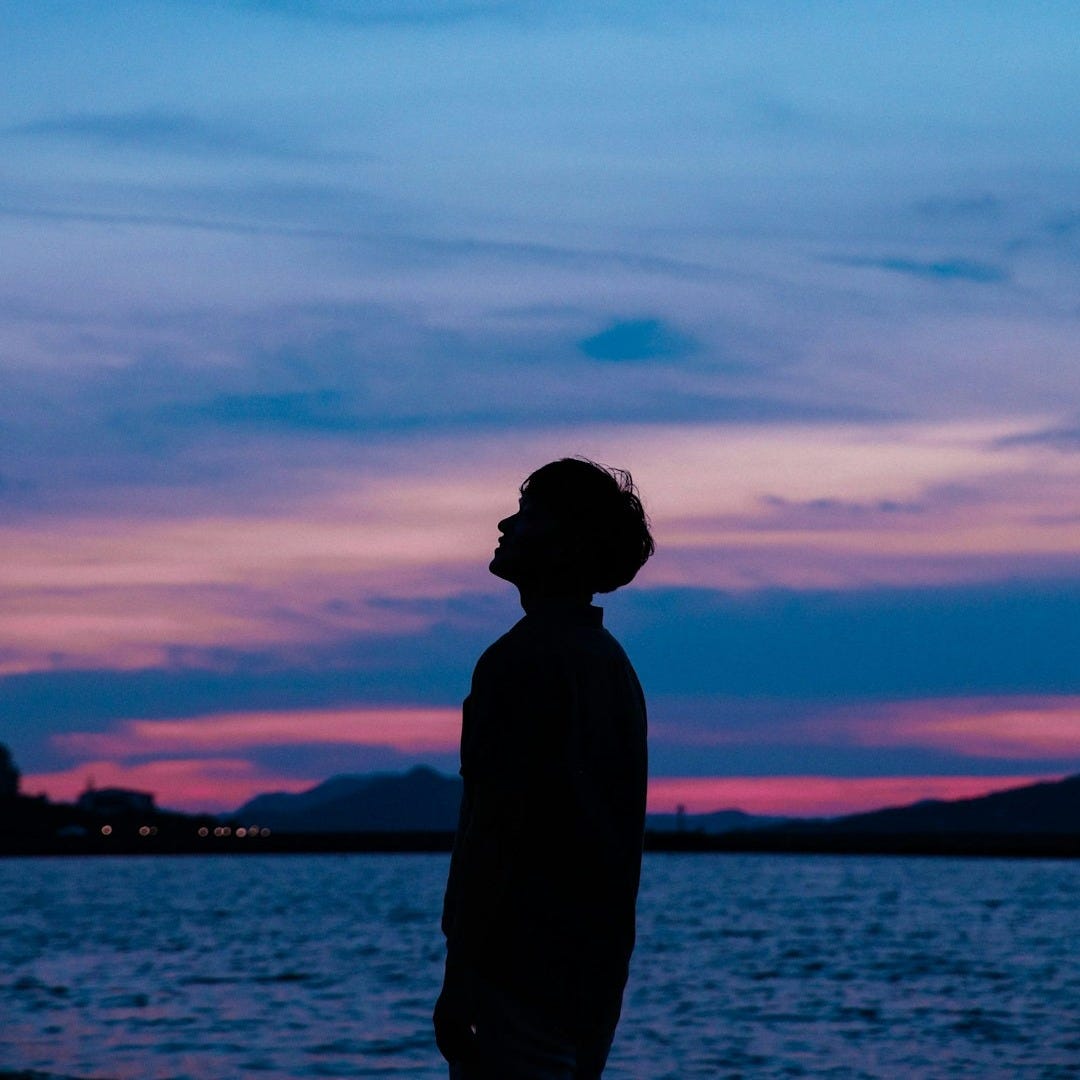 man standing near beach