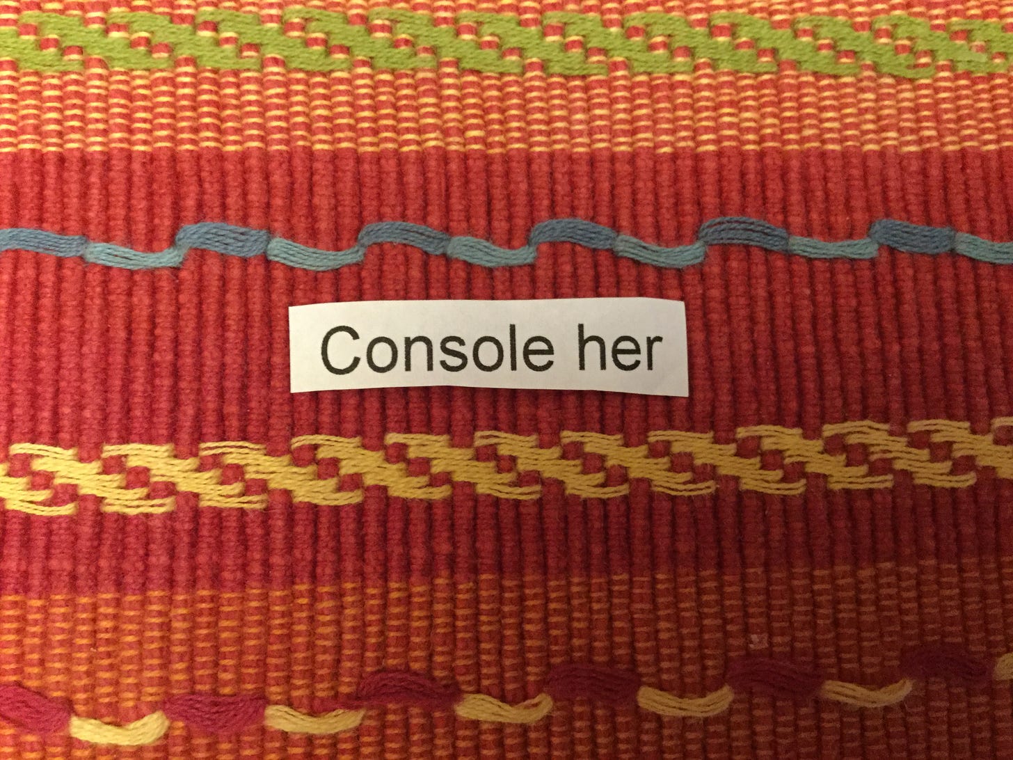 Colorful background with the words “Console her” placed on it.