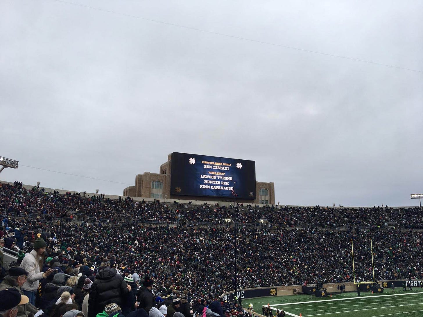 The Notre Dame Stadium video board displays the name Ben Testani