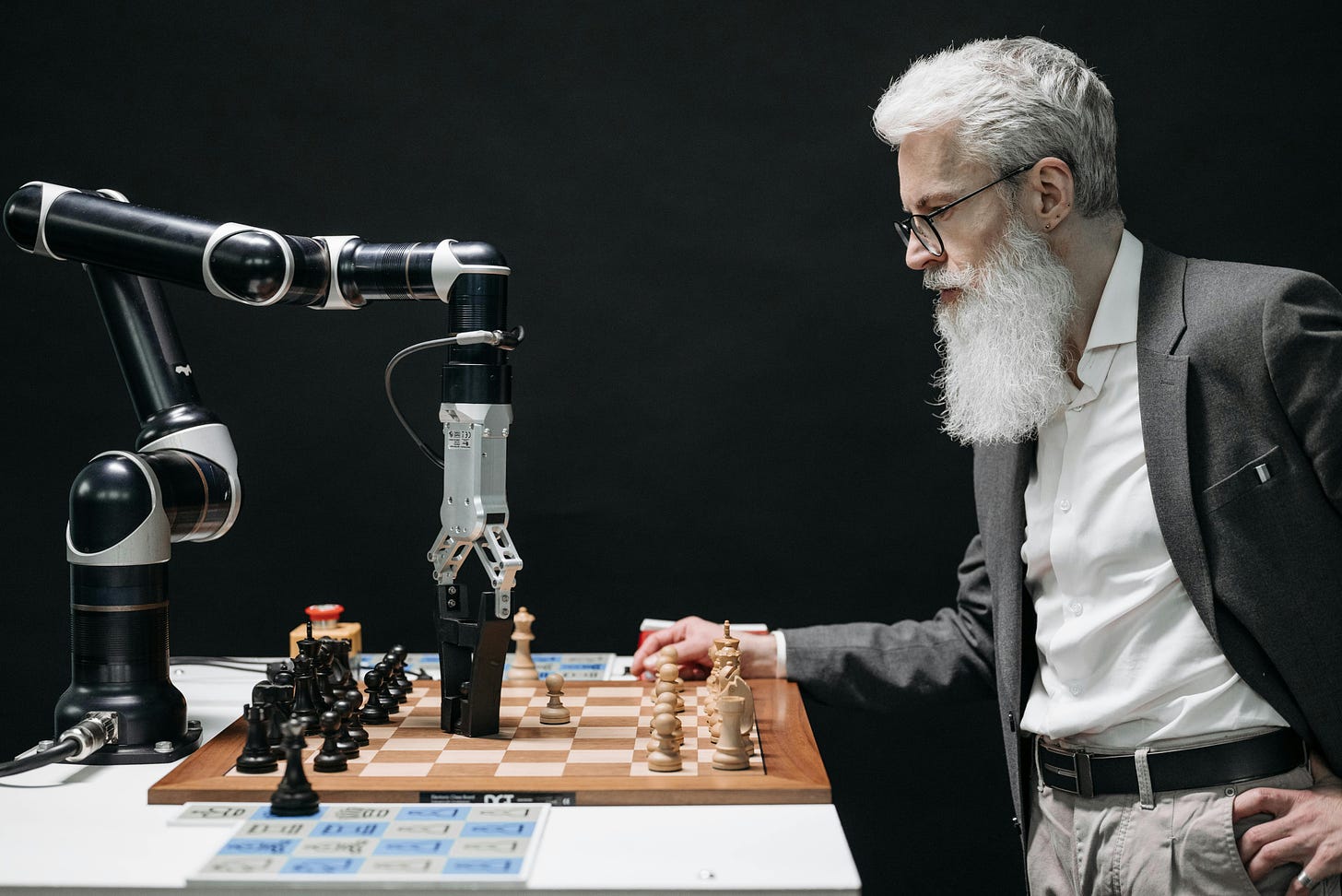 Machine vs. man playing chess