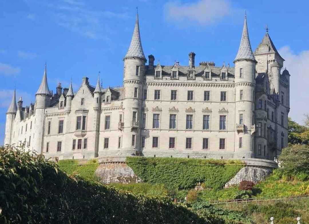 Dunrobin Castle sits atop a hill that overlooks the sea