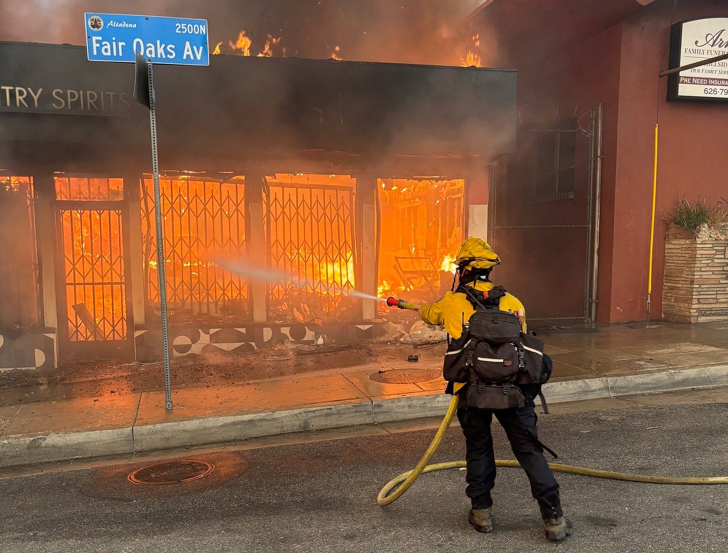 An Oceanside firefighter works to put out a structure fire on Thursday at the Eaton Fire in Los Angeles County. Oceanside Engine 6321 was deployed to the blaze last week. Courtesy photo