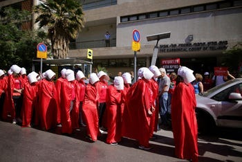 'Handmaidens' protest outside the rabbinical court in Tel Aviv, in May.
