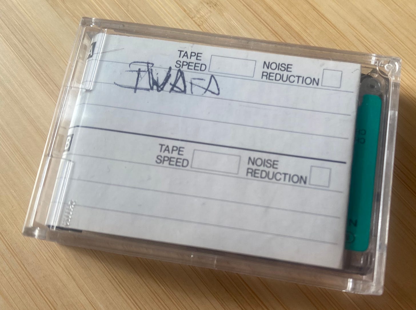 Photo of a small cassette case labeled "Iwata"