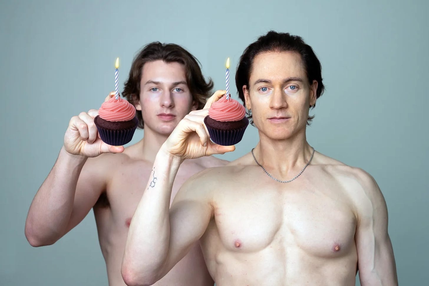 It's Bryan Johnson, of course! This is the image he took shirtless with his son standing behind him. In the original, they're holding up little vials of blood (I believe this was an article about their swapping), but I've covered those with two chocolate cupcakes with pink frosting.