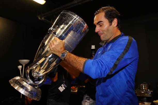 Roger Federer of Team Europe drinks champagne from Laver Cup trophy after winning the Laver Cup on the final day of the Laver cup on September 24,...