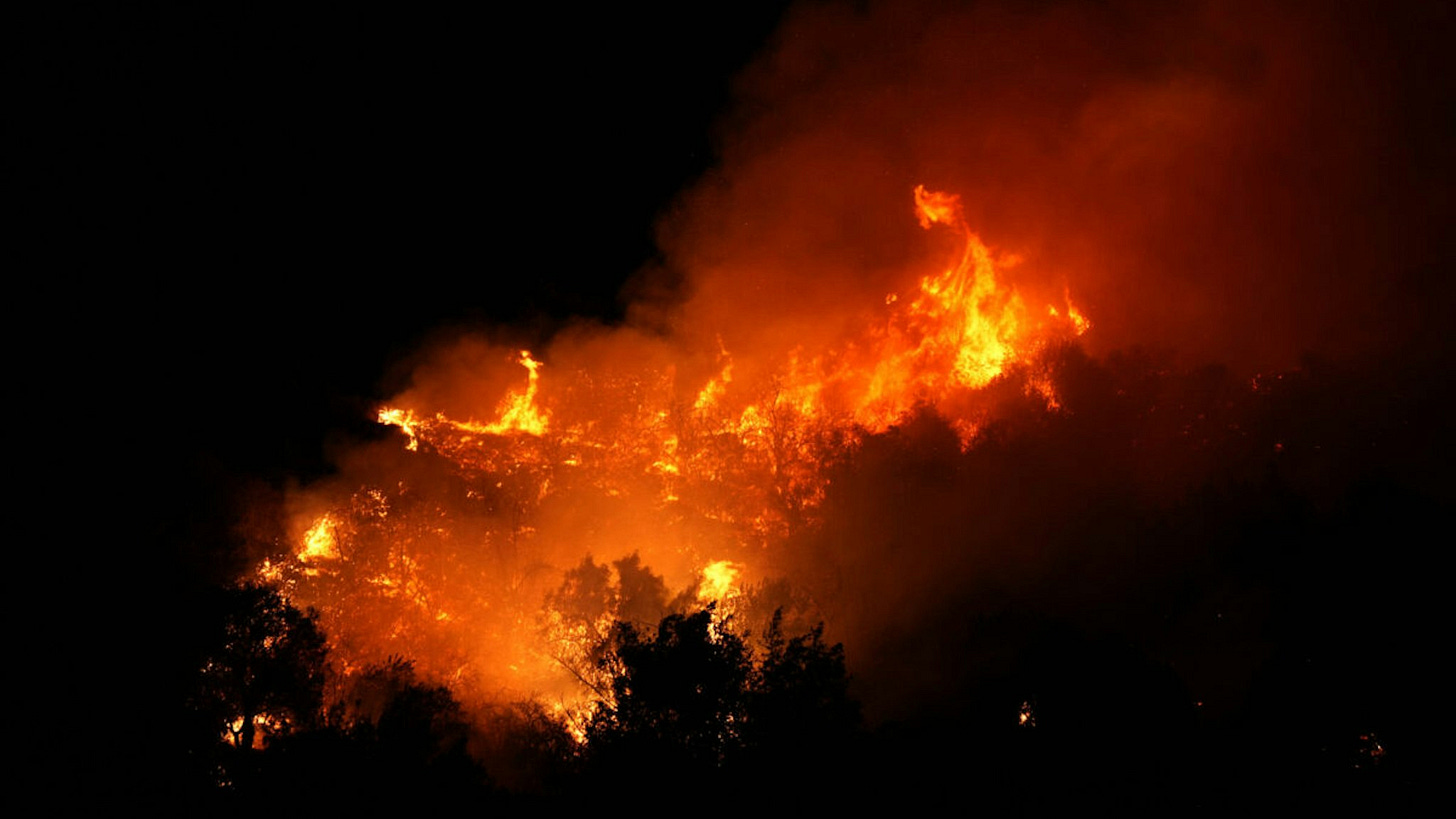 A view of engulfed wildfire as firefighters battle wildfires in Los Angeles as several blazes continue to tear through the region on January 10, 2025.