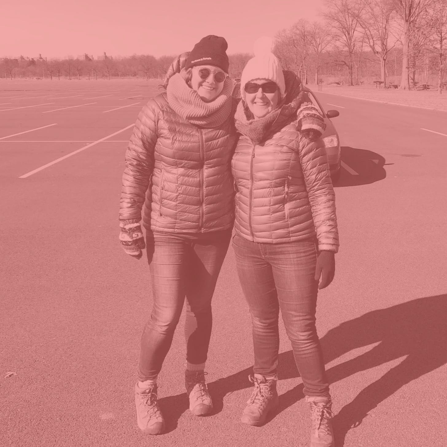 Alia and Fiona posed wearing the same jacket, boots, jeans, and a hat.