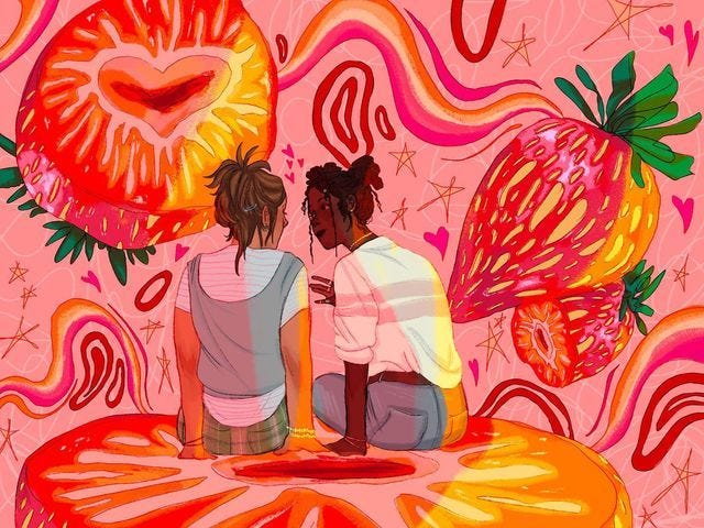 This may contain: two people sitting on a table in front of a wall with flowers and hearts painted on it