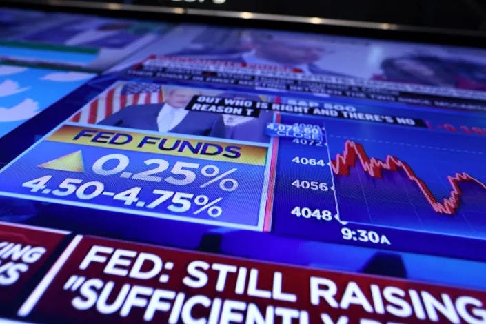 The Fed rate announcement is seen on a screen on the floor of the New York Stock Exchange (NYSE) in New York City, U.S., February 1, 2023. REUTERS/Andrew Kelly