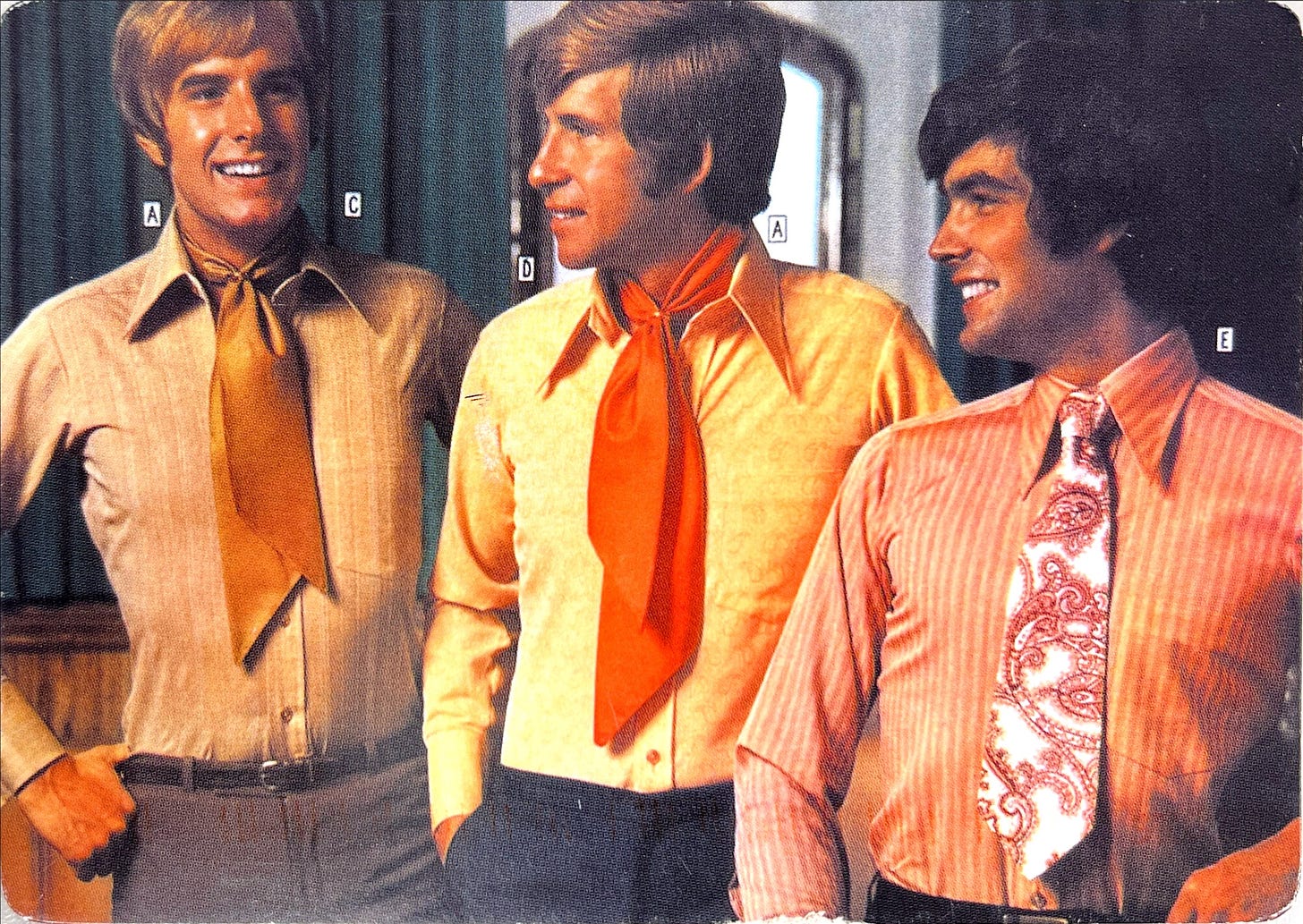 Photo of three 1970s looking guys in ties.