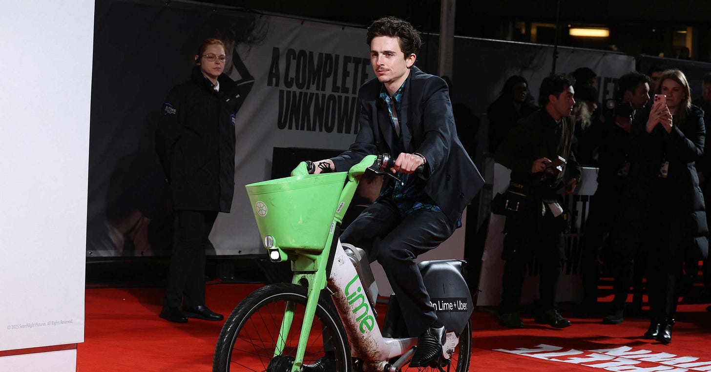 Timothée Chalamet Pairs His Premiere Outfit With a Lime Bike