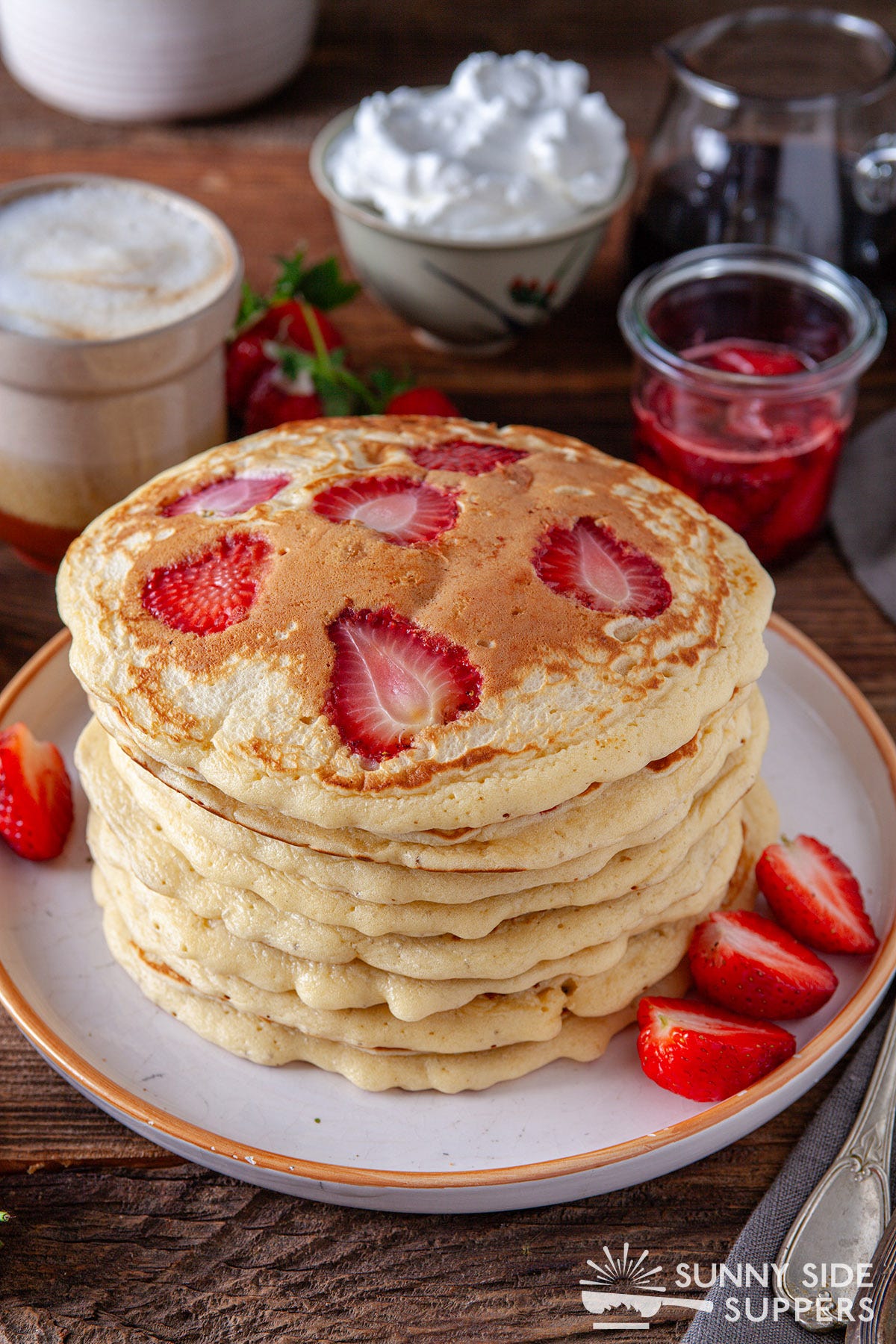Strawberry slices nestled in pancakes.