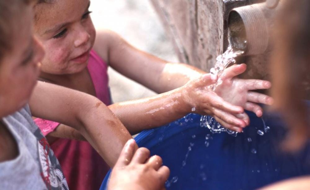 Children in the South Hebron Hills village of Susiya, where water is increasingly scarce: permits to dig wells and water tanks are rarely granted. One local well was recently demolished by settlers and an old car was pushed down it. Photo: kelleelund via