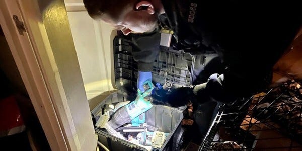 Officer examining goods in a black box