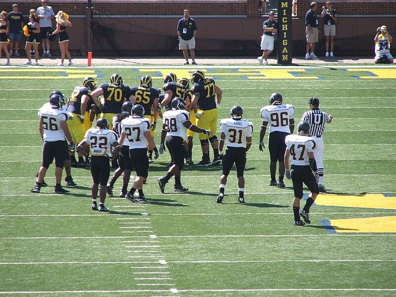 File:Michigan Appalachian State huddle.jpg