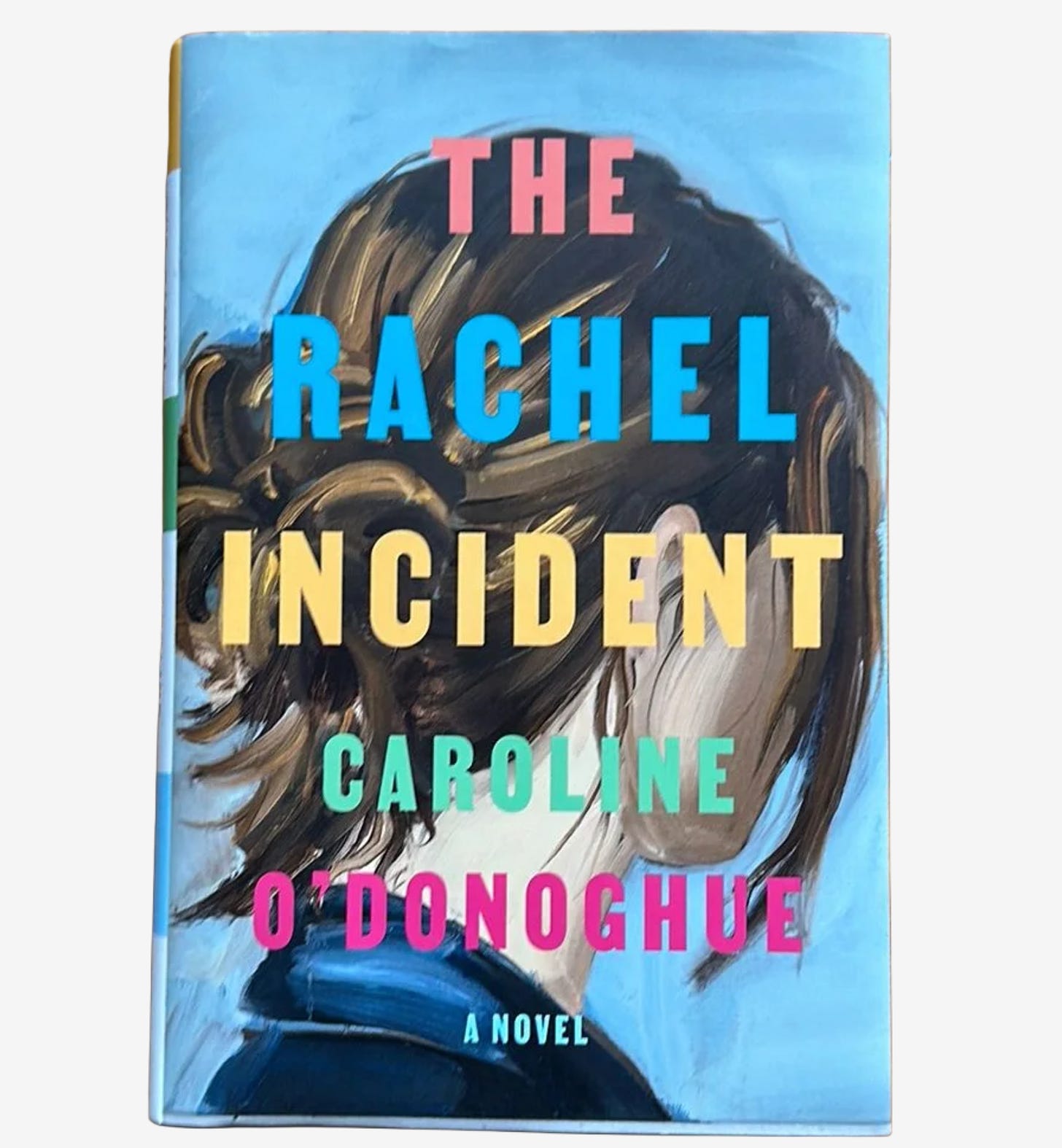 Hardcover edition of The Rachel Incident by Caroline O'DonoghueHardcover edition of The Rachel Incident by Caroline O’Donoghue (against a pale blue background, a painting of a white woman turned away from the viewer, wearing a navy blazer with long, straight, chocolate brown hair in a messy bun. Over the portrait, the title in orange, blue, and yellow text, with the author’s name in green and hot pink text).