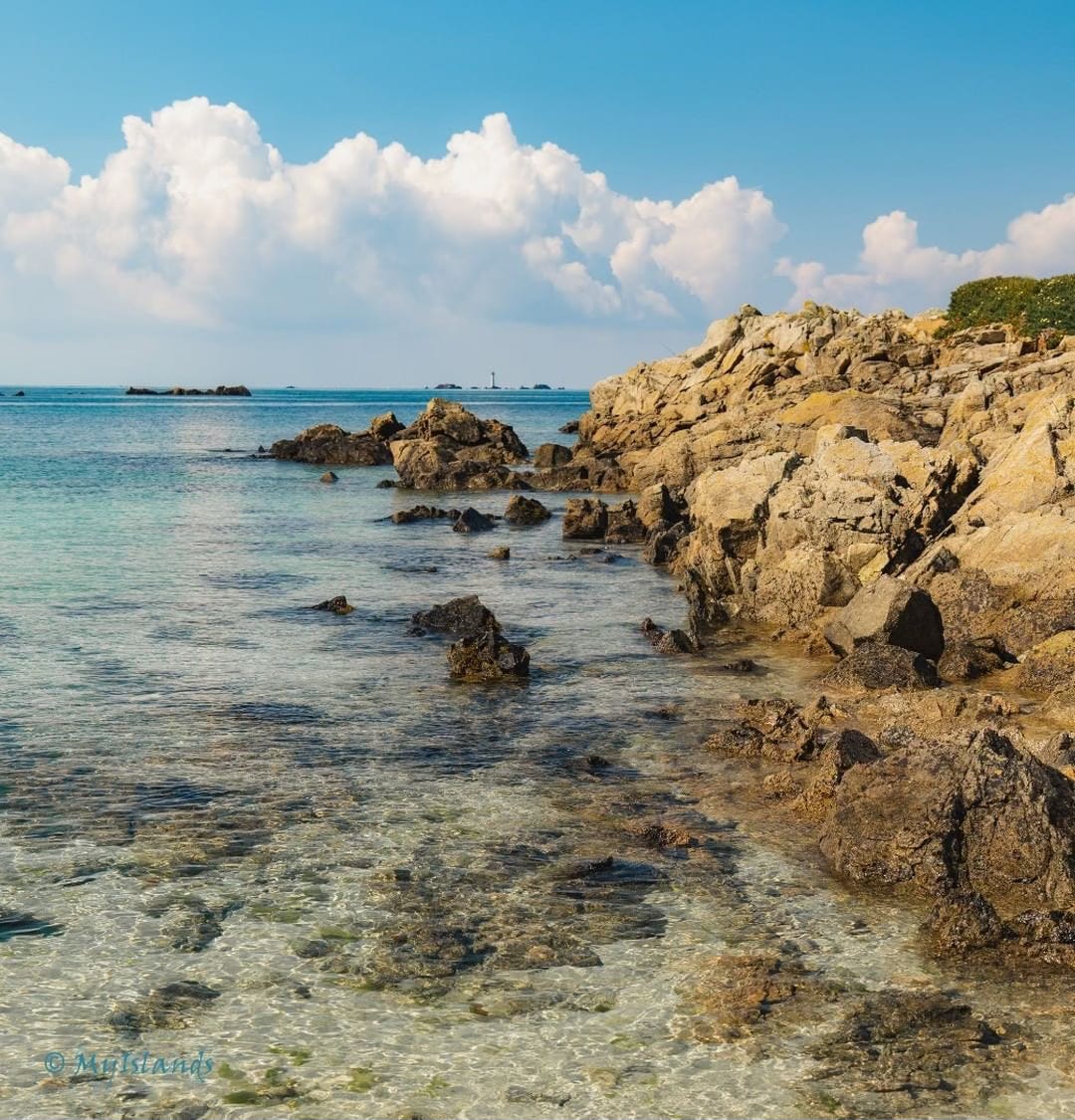 “Clear waters at L'Eree, Guernsey with Les Hanois Lighthouse in the distance.” Caption and photo by Peter Tiffin