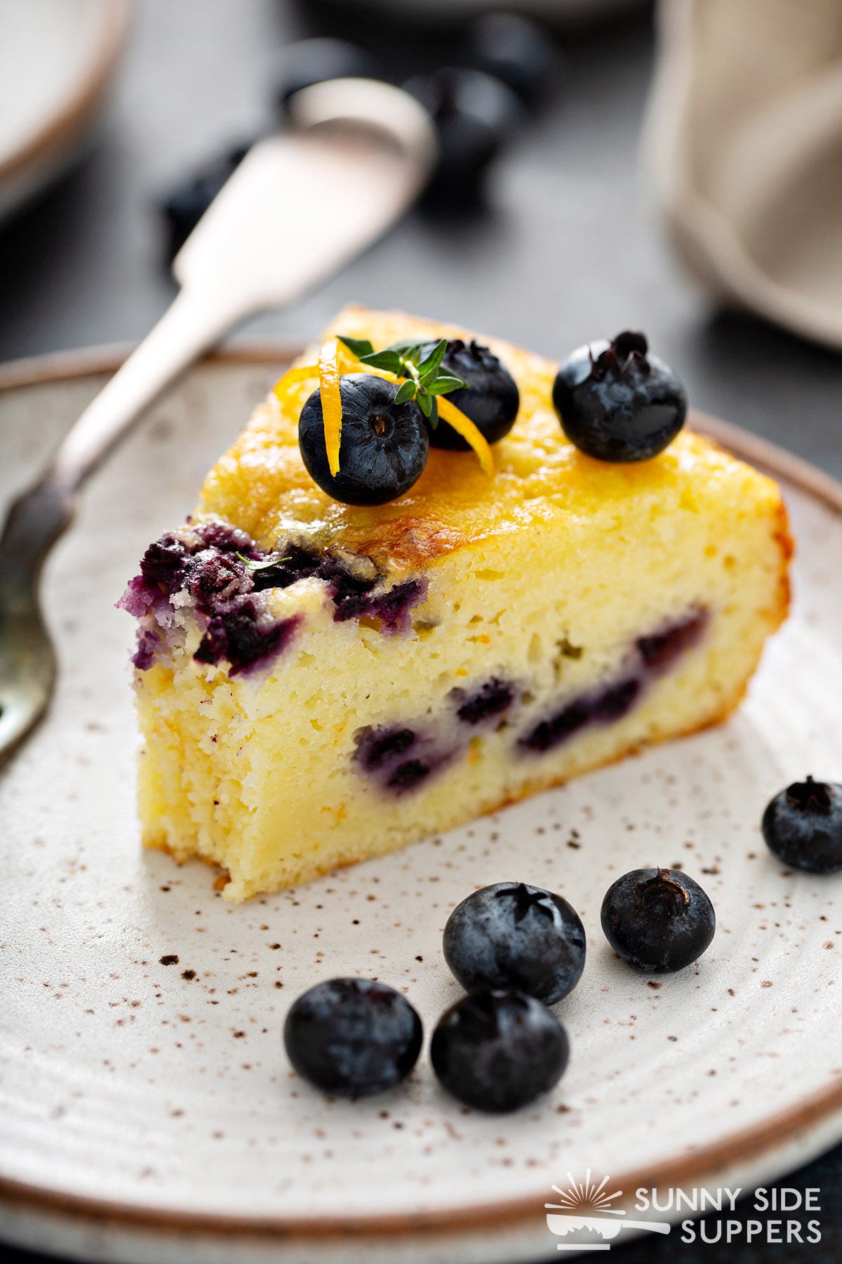 A slice of blueberry coffee cake.
