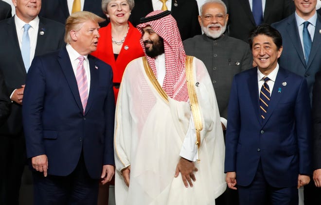 OSAKA, JAPAN - JUNE 28: U.S. President Donald Trump speaks with Saudi Arabia's Crown Prince Mohammed bin Salman during a family photo session at G20 summit on June 28, 2019 in Osaka, Japan. U.S. President Donald Trump arrived in Osaka on Thursday for the annual Group of 20 gathering together with other world leaders who will use the two-day summit to discuss pressing economic, climate change, as well as geopolitical issues. The US-China trade war is expected to dominate the meetings in Osaka as President Trump and China's President Xi Jinping are scheduled to meet on Saturday in an attempt to resolve the ongoing the trade clashes between the world's two largest economies. (Photo by Kim Kyung-Hoon - Pool/Getty Images)