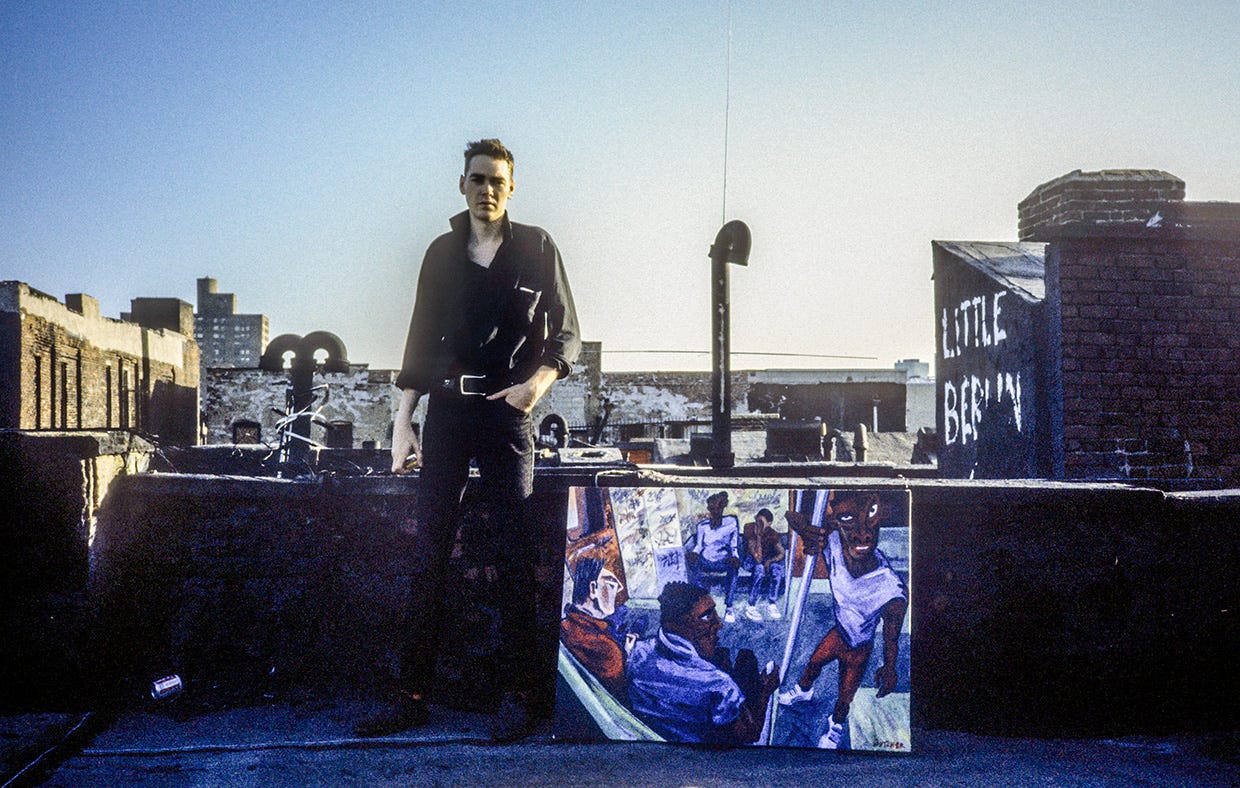 1984 photo of Steve Butcher with subway painting on Ludlow St rooftop. Edythe and Eli Broad Museum. Michigan