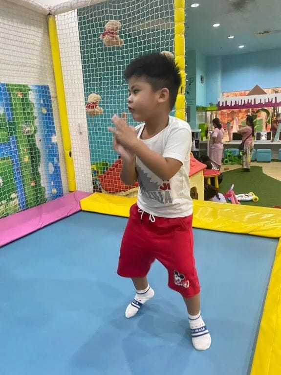 Little boy enjoying the trampoline at at iActive SM City Fairview