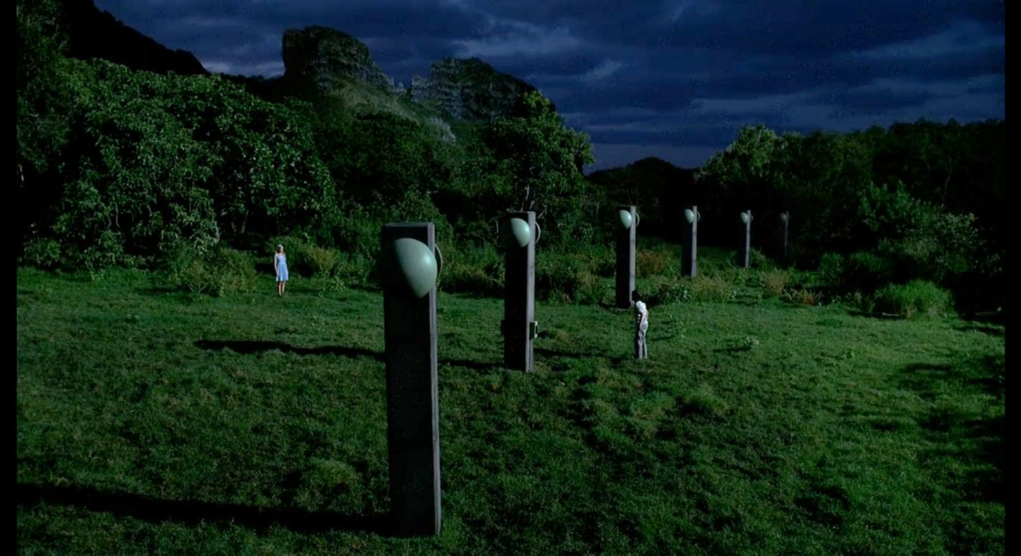 Ben Linus and his mother face each other on opposite sides of the sonic fence.